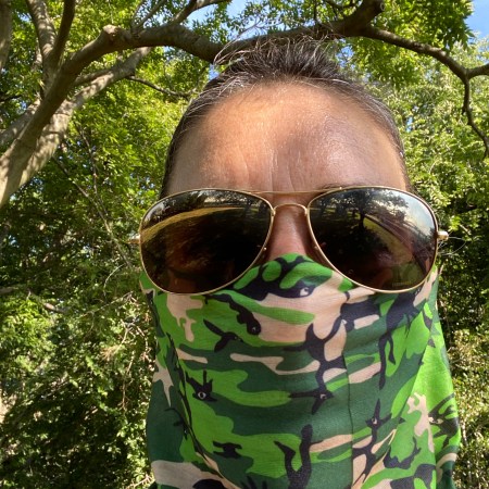 Woman wearing neck fleece in park