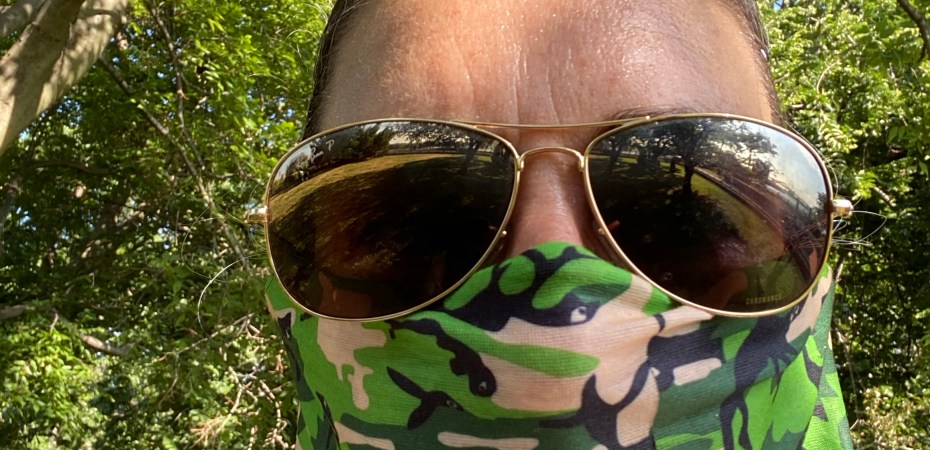 Woman wearing neck fleece in park